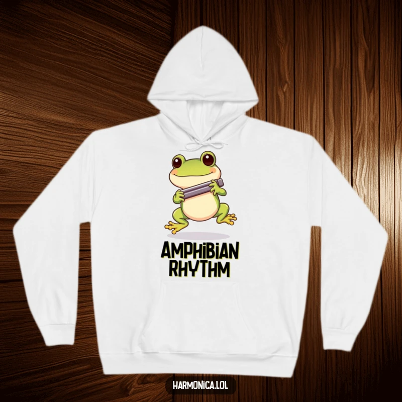 Funny Cheerful Frog Harmonica Hoodie: A happy frog hopping along while holding a harmonica, offering warmth and musical cheer.